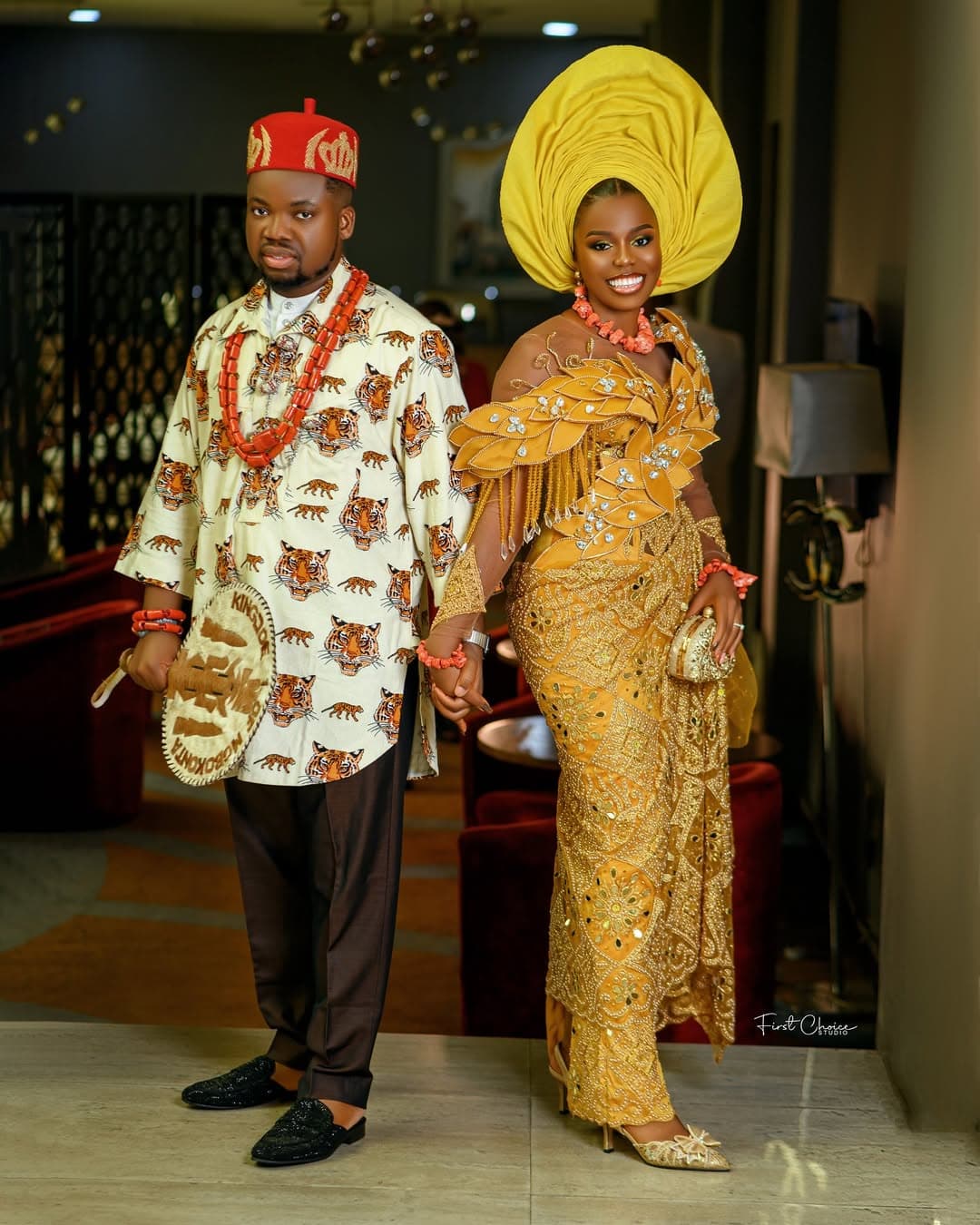 Traditional couple in gold aso-oke