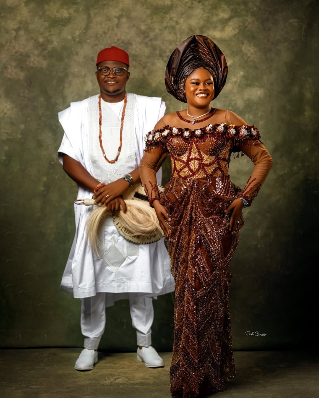 Couple in brown and white traditional studio portrait