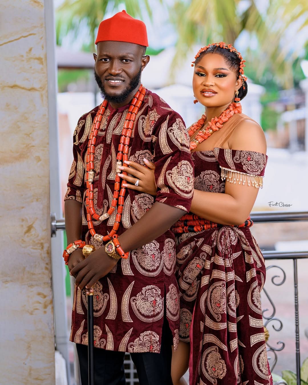Couple in matching isiagu outfit with coral beads