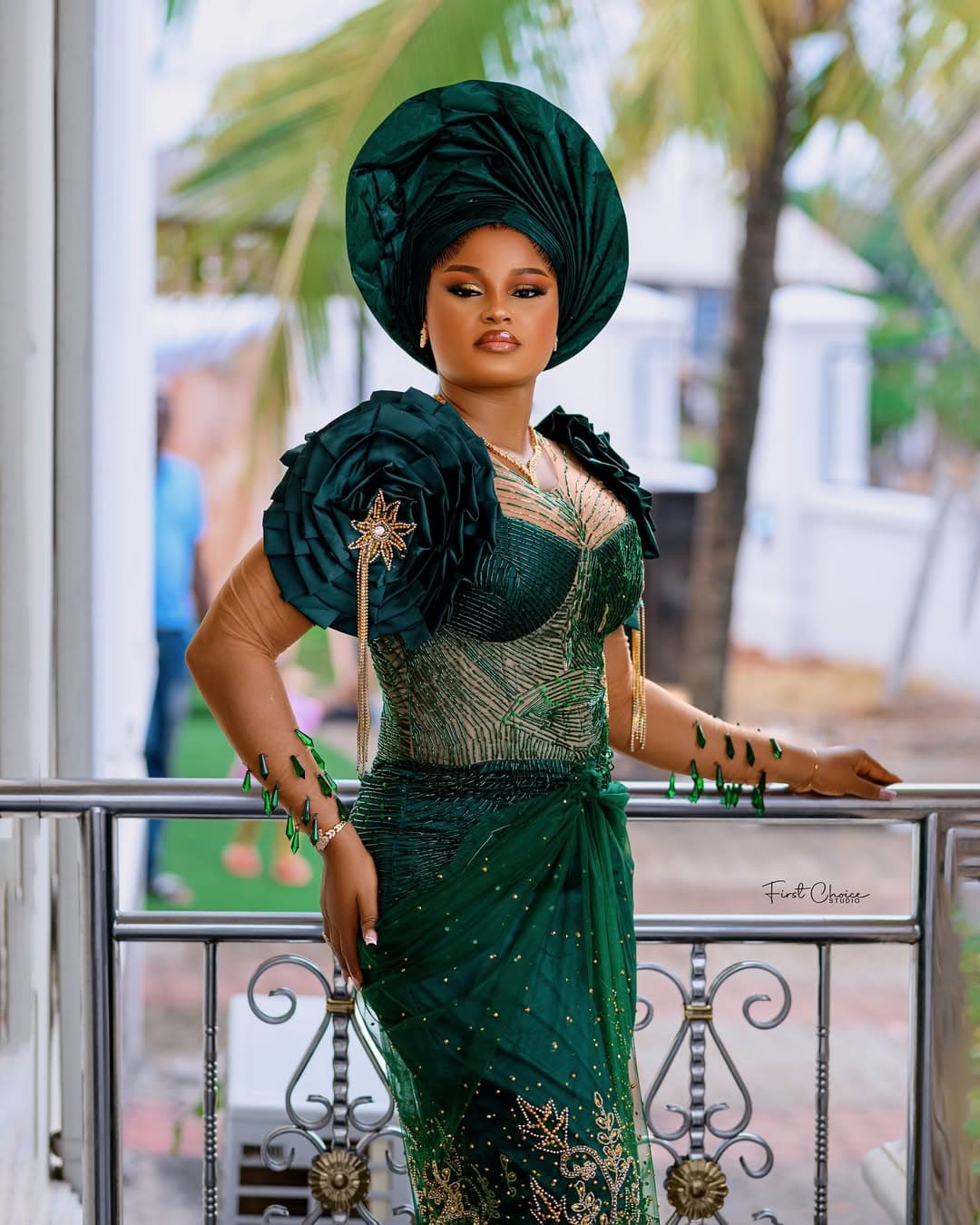 Bride in emerald green gele and dress