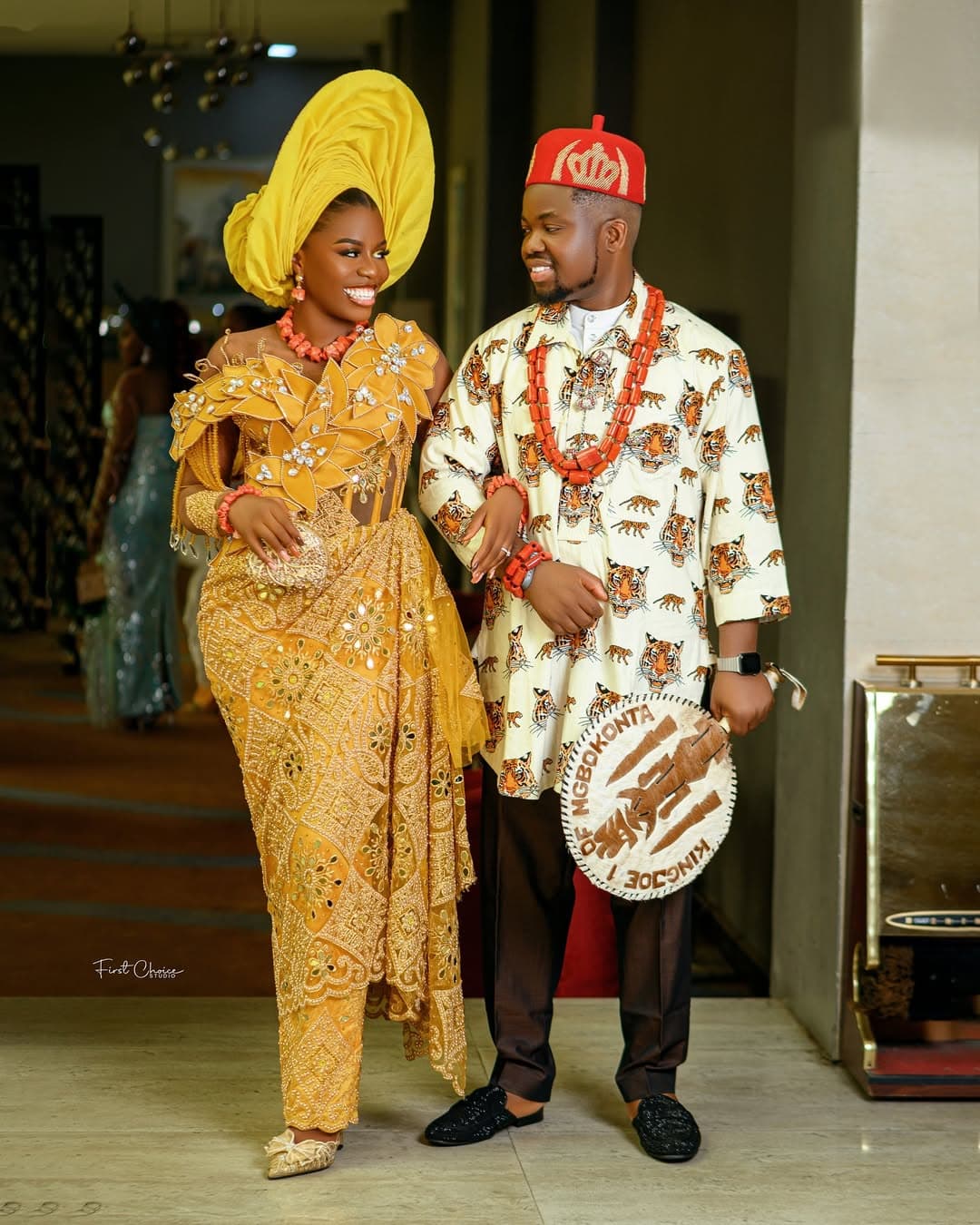 Traditional couple walking in gold attire