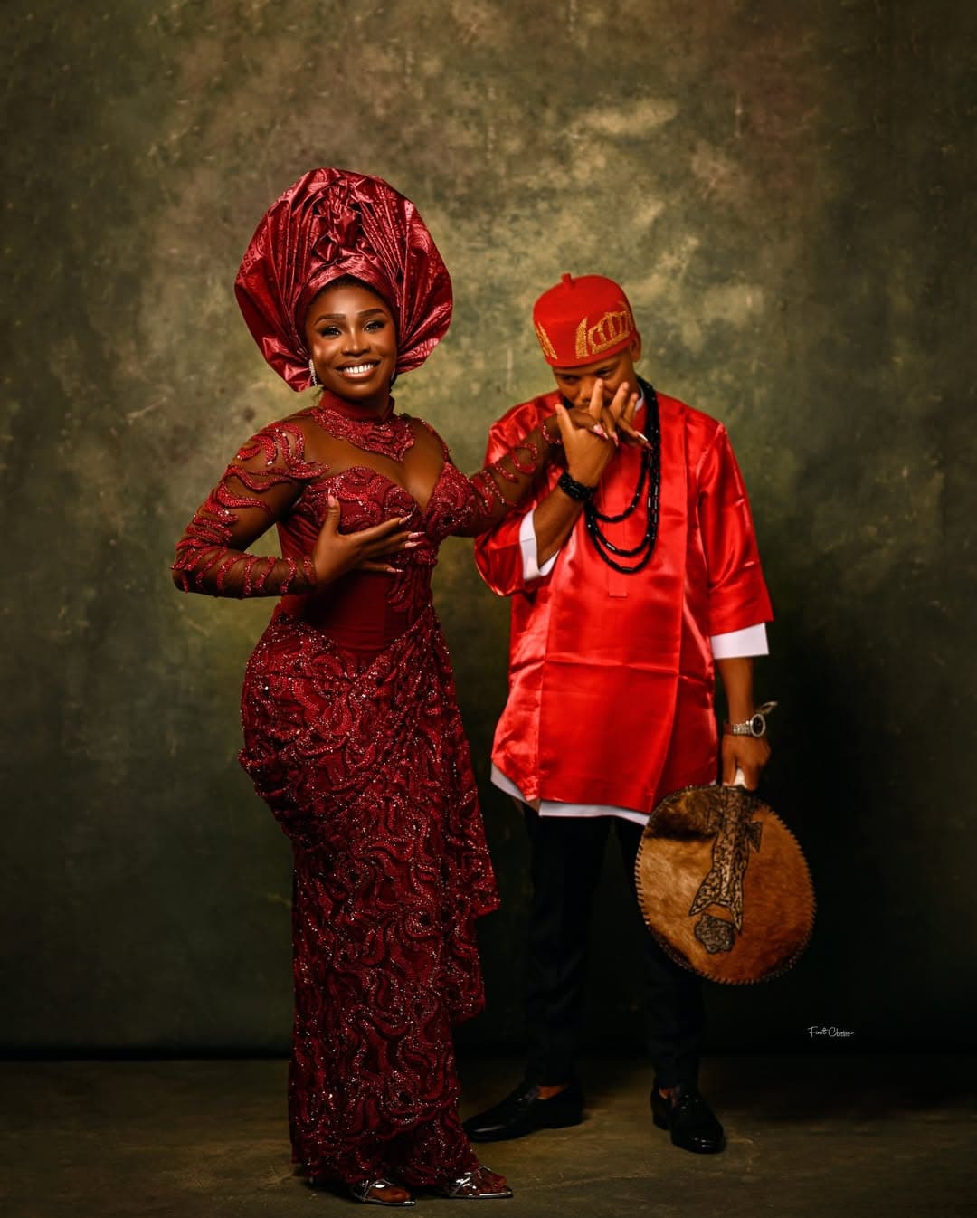 Traditional couple in red studio portrait