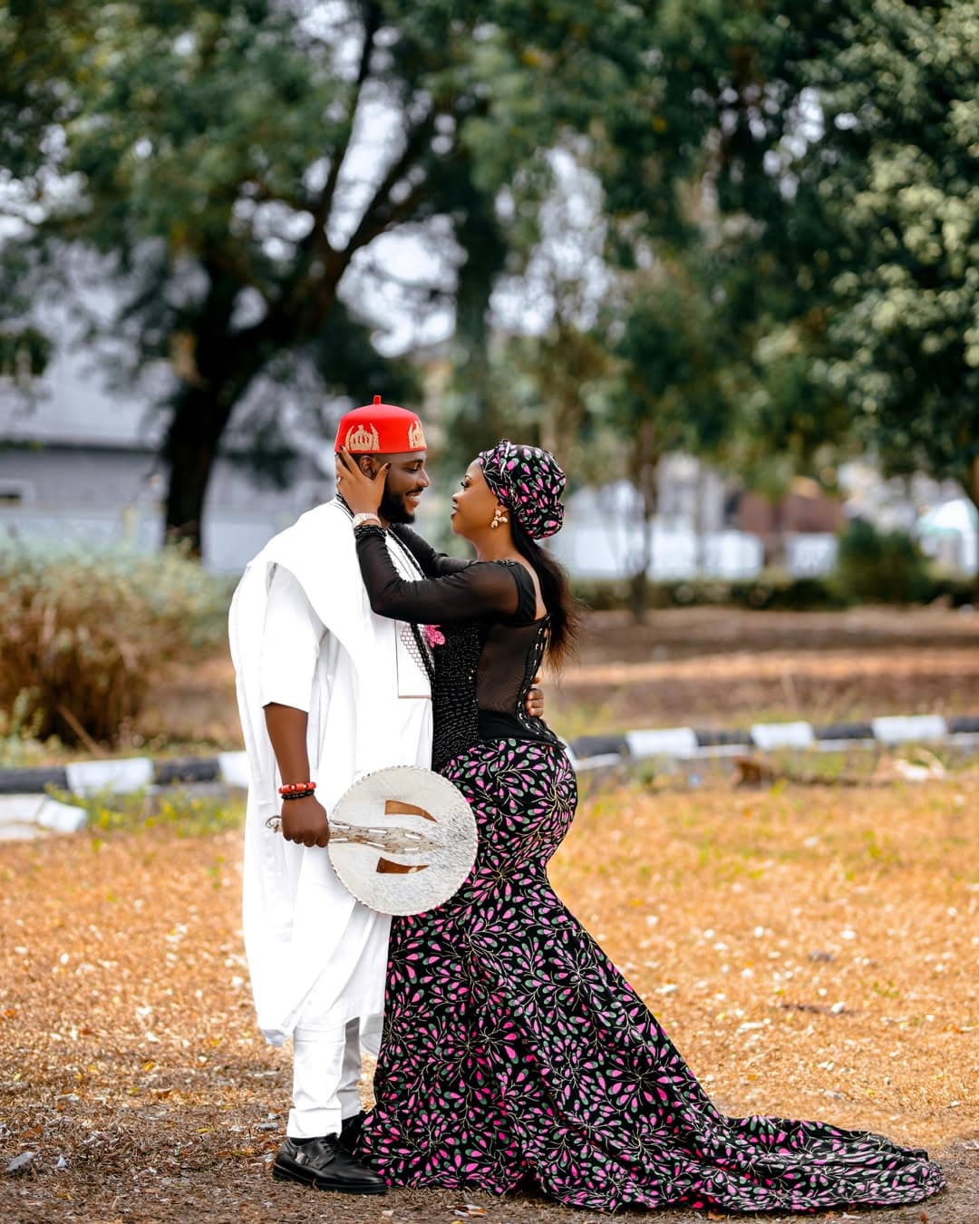 Romantic outdoor portrait in white and patterned traditional attire
